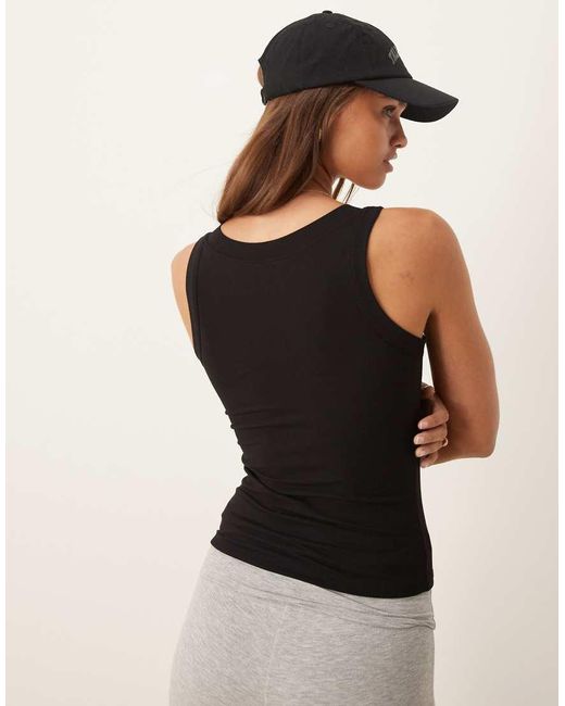 Camiseta De Estar Por Casa Negra Moldeadora Sin Mangas 365 De Tala de color Black