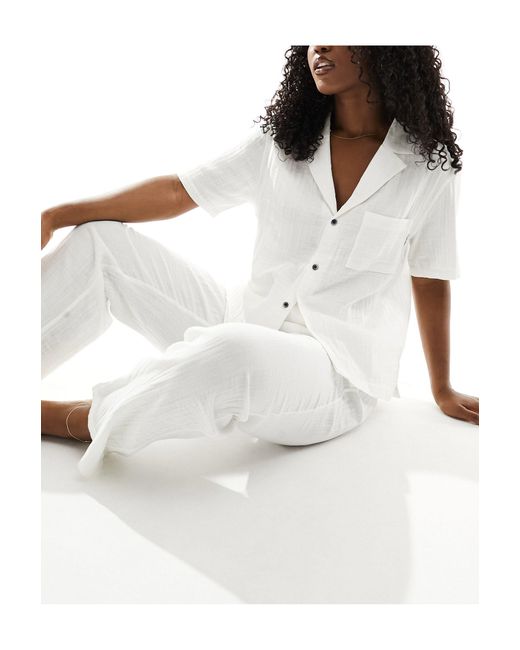 Chemise boutonnée en coton texturé Calvin Klein en coloris White