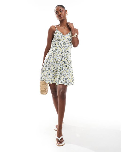 ONLY White – mini-trägerkleid mit gebundener rückseite und zitronenmuster