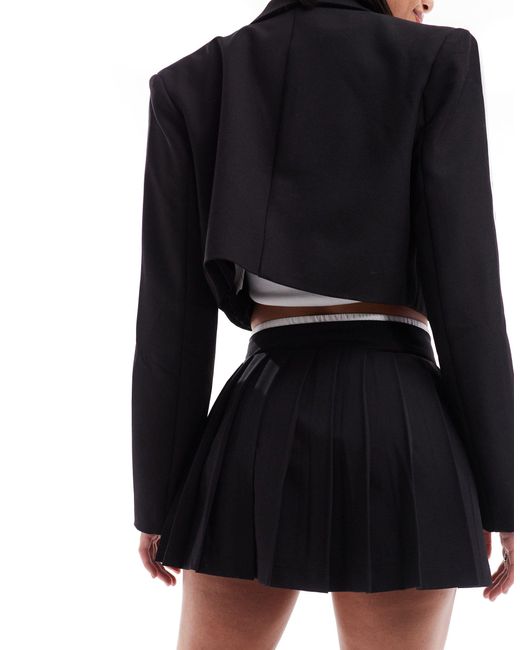 Mini-jupe d'ensemble coupe plissée ajustée avec poches Bershka en coloris Black
