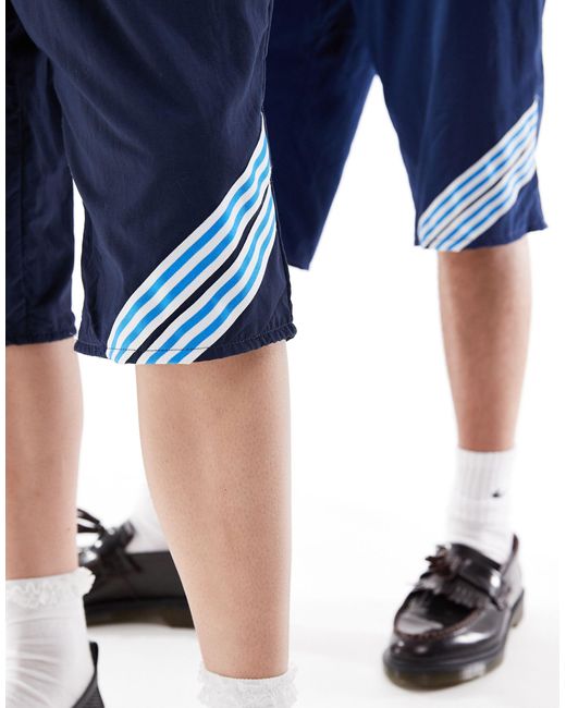 Reclaimed (vintage) Blue Revived X Glass Onion Unisex Track Boy Shorts With Taping Detail