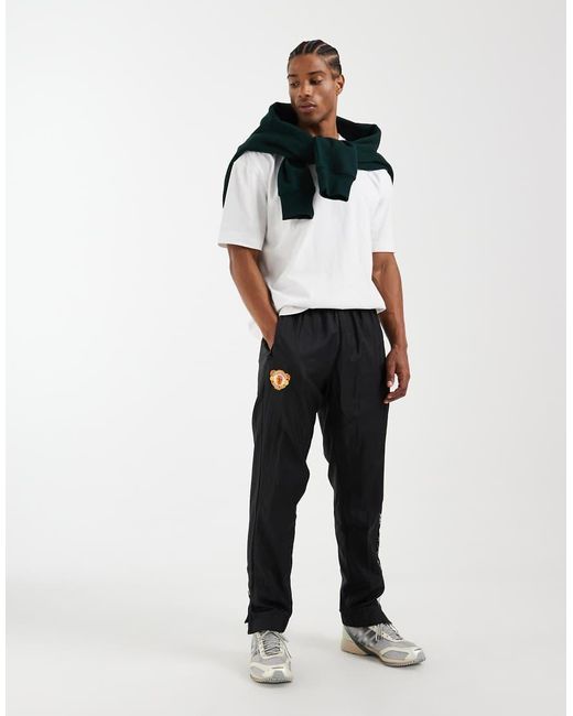 Adidas Originals Black Manchester United Woven 90 Trousers for men
