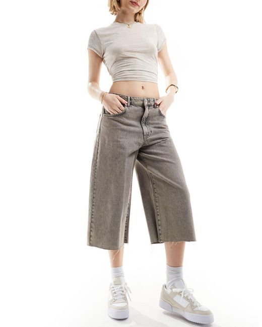 Short long en jean avec ourlets effilochés - délavé Pull&Bear en coloris Gray