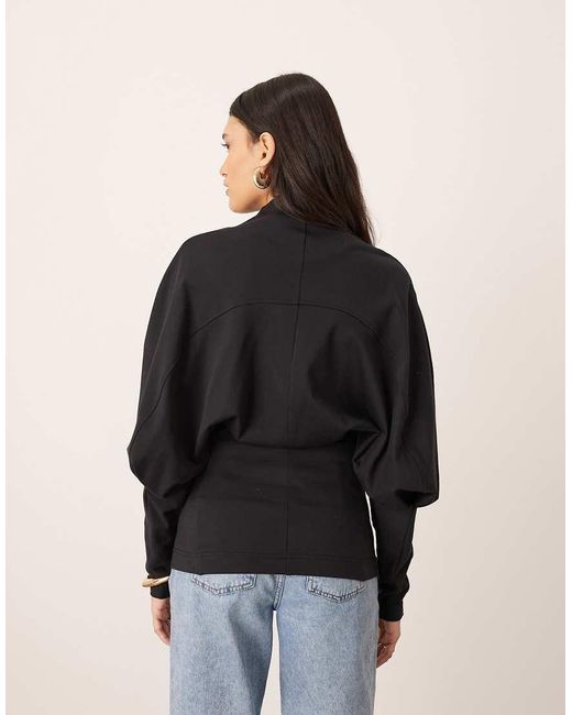 ARRANGE Black Sculptural Jersey Longline Top