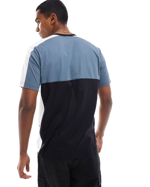 Camiseta negra y gris con cuello redondo y diseño color block Champion de hombre de color Blue
