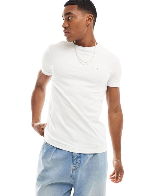 T-shirt slim fit elasticizzata bianca di Calvin Klein in White da Uomo