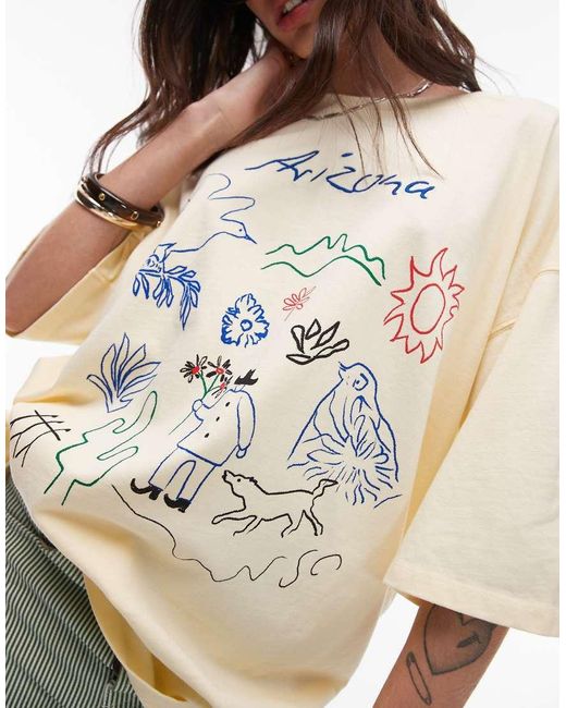 T-Shirt Oversize Color Latticello Con Stampa Ricamata “Arizona” di TOPSHOP in White
