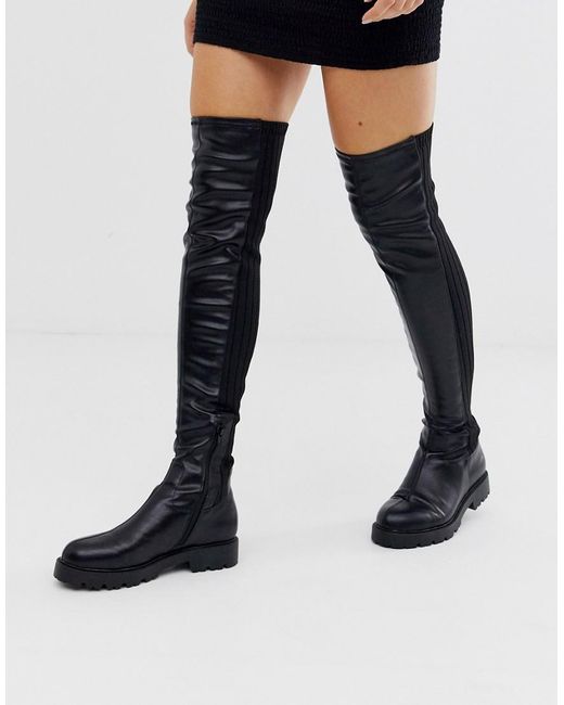 thigh high flat black leather boots