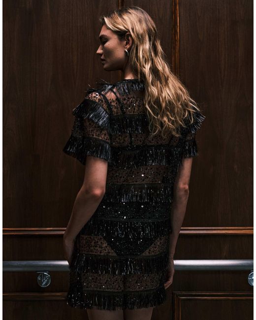 Tana - robe t-shirt courte transparente à rayures ornée Ghospell en coloris Brown