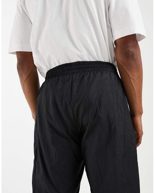 Adidas Originals Black Manchester United Woven 90 Trousers for men