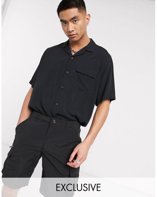 camicia nera senza maniche