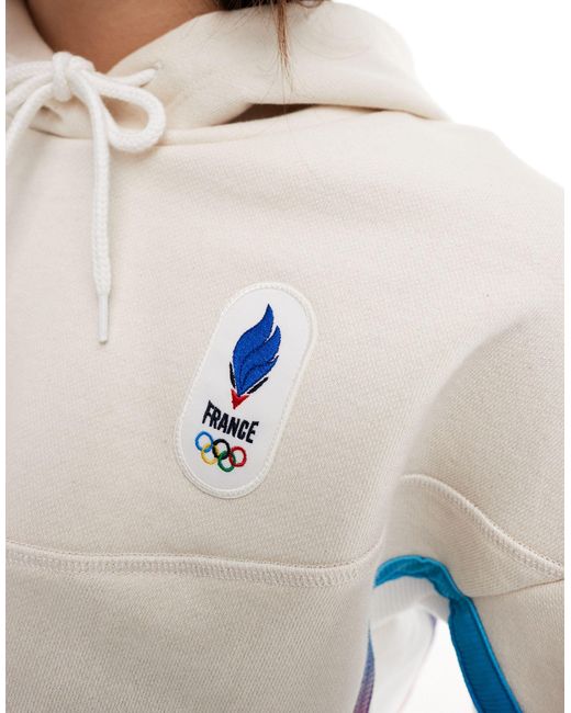 Sudadera color crudo con capucha y diseño del equipo francés para los juegos Le Coq Sportif de color White