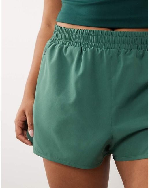 4505 Green Curve Icon Woven Running Shorts With Zip Pockets
