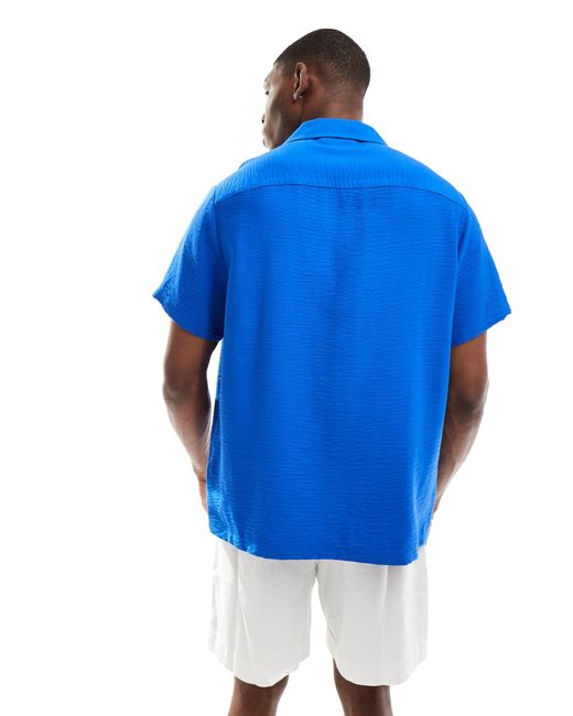 Camicia a maniche corte vestibilità comoda stropicciata con rever di ASOS in Blue da Uomo