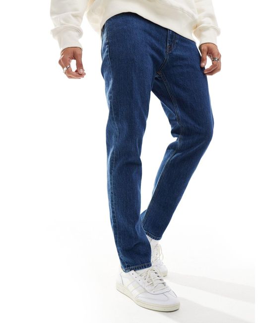 Jeans dad fit affusolati regular fit lavaggio scuro di Tommy Hilfiger in Blue da Uomo