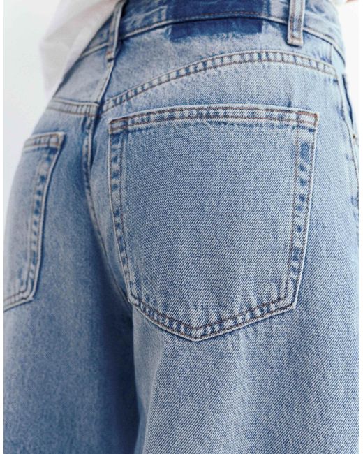Jean ample effet patchwork - moyen Pull&Bear en coloris Blue