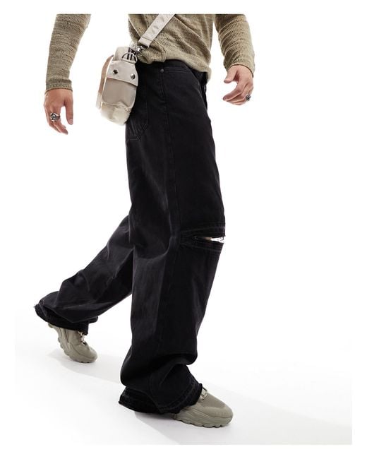 Astro - jeans larghi a fondo ampio neri con strappo sul ginocchio e dettagli invecchiati di Weekday in Black da Uomo