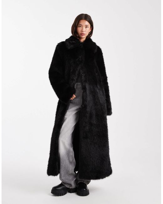 Manteau long en fausse fourrure avec liseré ASOS en coloris Black