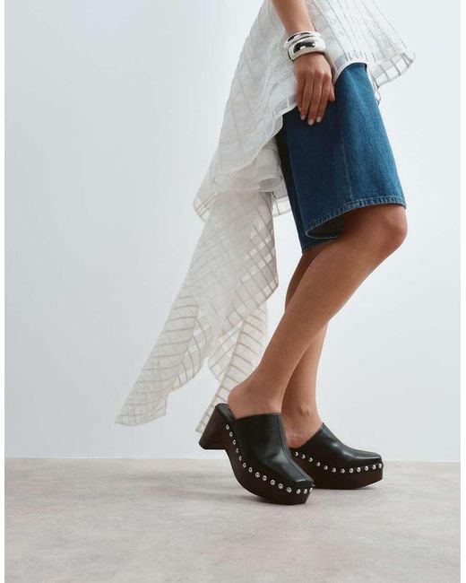 ARRANGE White Leather Studded Clogs