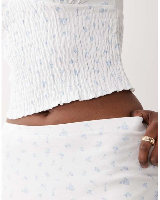 The Frolic White Exclusive Plunge Neck Shirred Waist Top