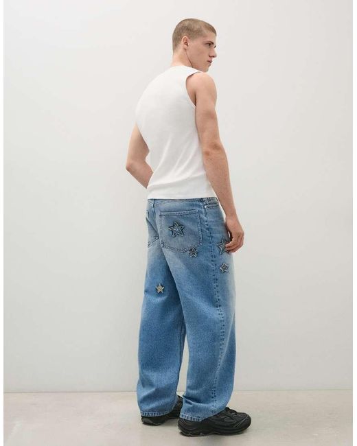 Bershka Blue baggy Jeans With Print And Patches for men