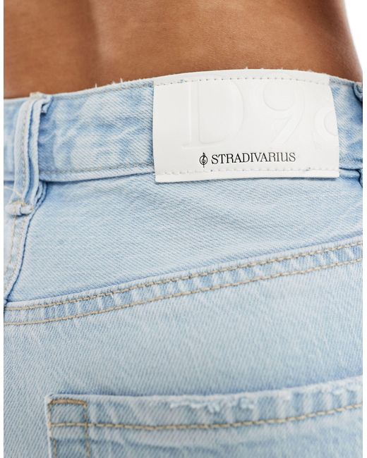Petite - jeans dritti lavaggio chiaro di Stradivarius in Blue