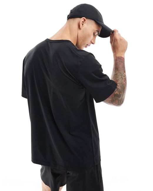 T-shirt dri-fit à motif virgule Nike pour homme en coloris Black