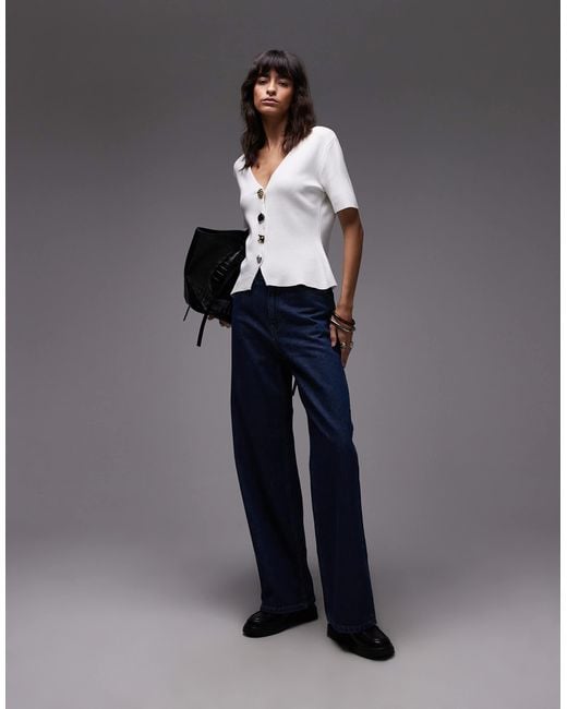 Gilet à manches courtes et col v en maille compacte avec boutons dorés Mango en coloris Gray