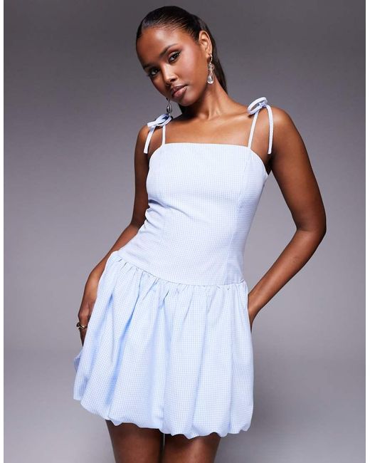 Vestido Corto A Cuadros Vichy Azules Con Tirantes Anudados Y Falda Abullonada Exclusivo De Kaiia de color White