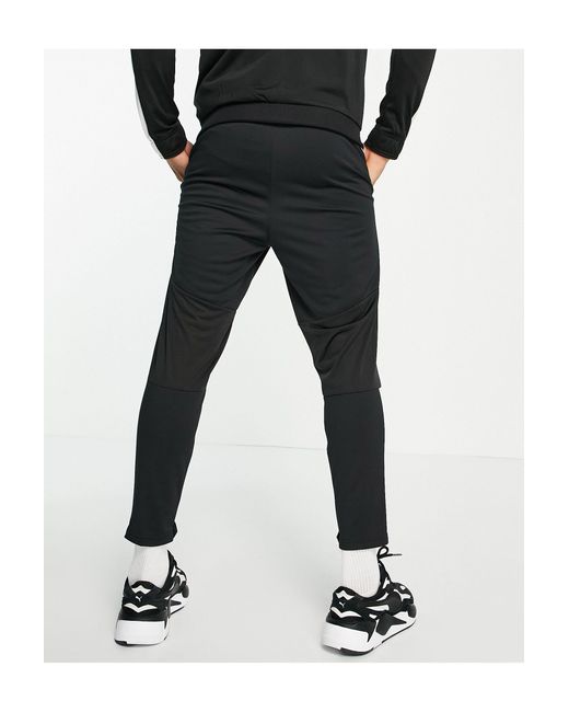 Pantalones PUMA de hombre de color Negro | Lyst