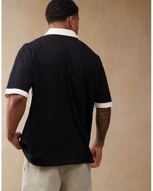 ASOS – kastiges oversize-poloshirt in Black für Herren