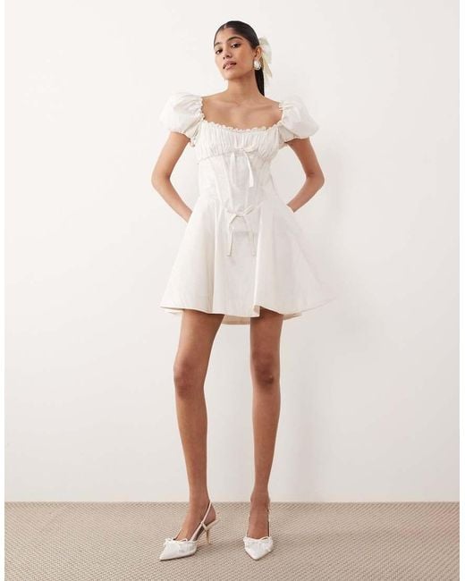 For Love & Lemons Natural Bridal Evaline Puff Sleeve Corset Bow Detail Open Back Mini Dress