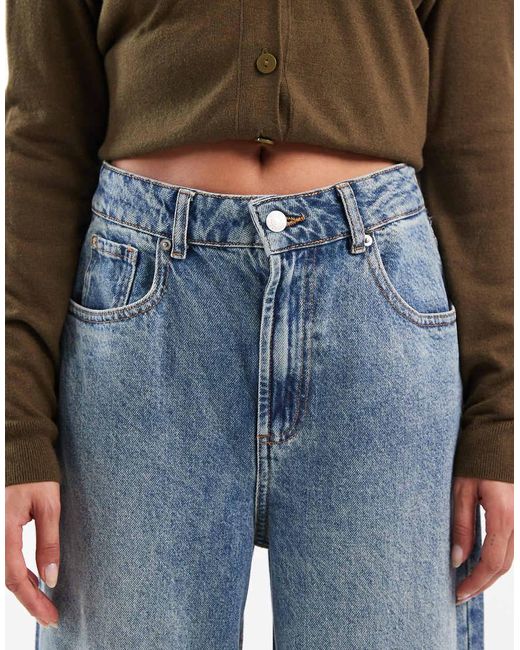 Vaqueros De Pernera Ancha Y Talle Alto Con Lavado Y Detalle De Tira Ajustable De -Azul ASOS de color Blue