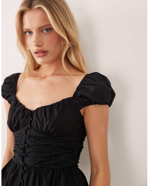 Nobody's Child Black Caia Cotton Puff Cap Sleeve Ruffle Hem Top