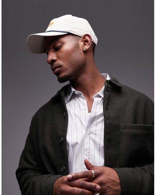 Gorra Tostada Con Estampado Gráfico Del Logo De -Neutro New Balance de color Natural