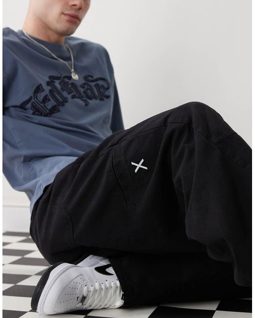 Pantalon bouffant effet raccordé à surpiqûres - délavé Collusion pour homme en coloris White