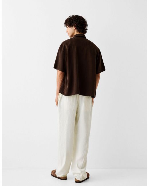 Pantaloni con fondo ampio di Bershka in White da Uomo