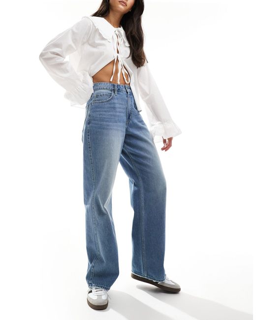 Jeans extra larghi a vita molto alta lavaggio medio di Hollister in Blue