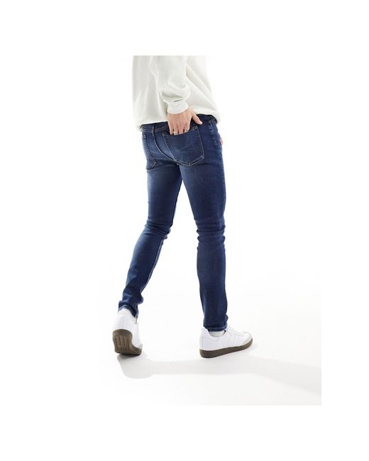 Jeans skinny lavaggio medio di ASOS in Blue da Uomo