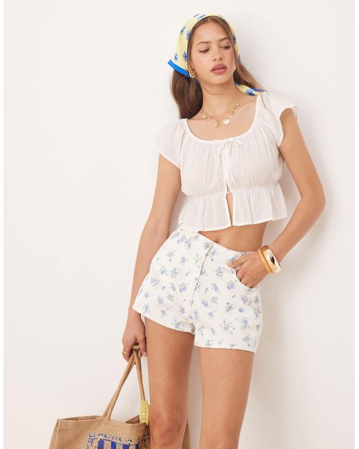 Short trapèze en jean à petites fleurs - bleu ASOS en coloris Blue