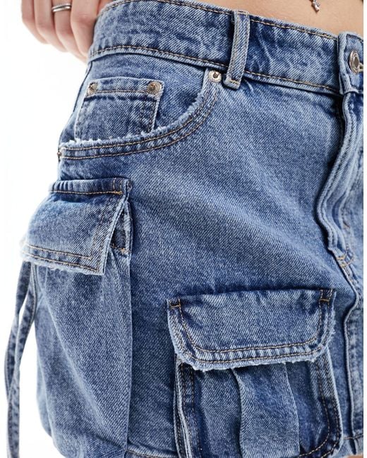 Mini-jupe en jean avec poches multiples - moyen Pull&Bear en coloris Blue