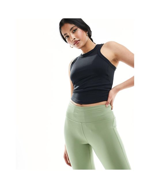 Nike - one dri-fit - crop top senza maniche aderente di Nike in Green