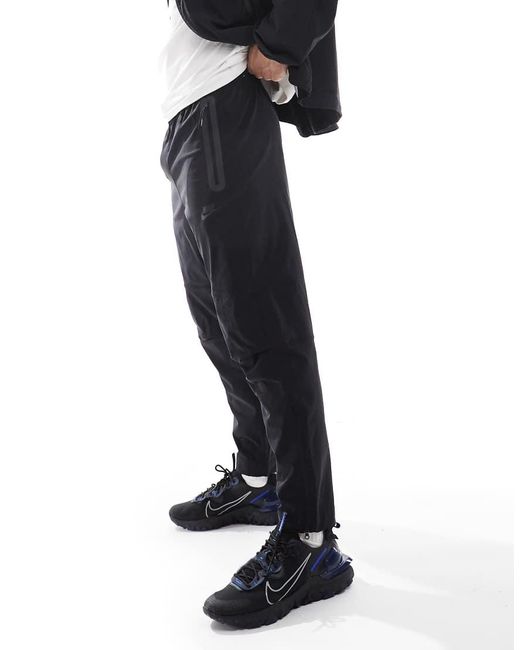 Nike Blue Tech Woven Open Hem Trousers for men