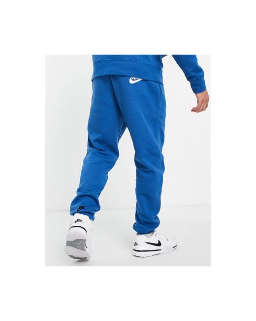 Nike Sport Essentials Multi Futura Logo Fleece joggers in Blue for Men |  Lyst Australia