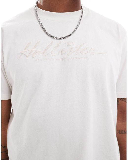 Camiseta color crema holgada con logo bordado en el pecho Hollister de hombre de color White
