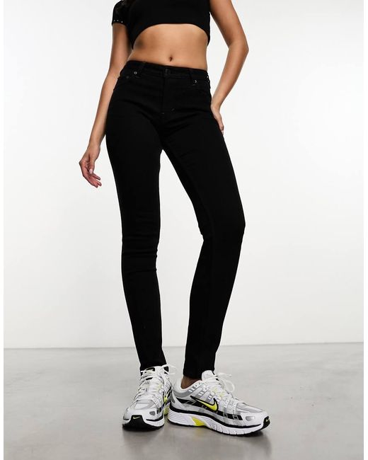 Vaqueros Negros De Corte Pitillo Y Talle Medio Spare De Weekday de color Black