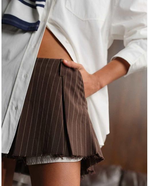 Monki Brown Pleated Mini Skirt With Frayed Edge And Pocket Detail