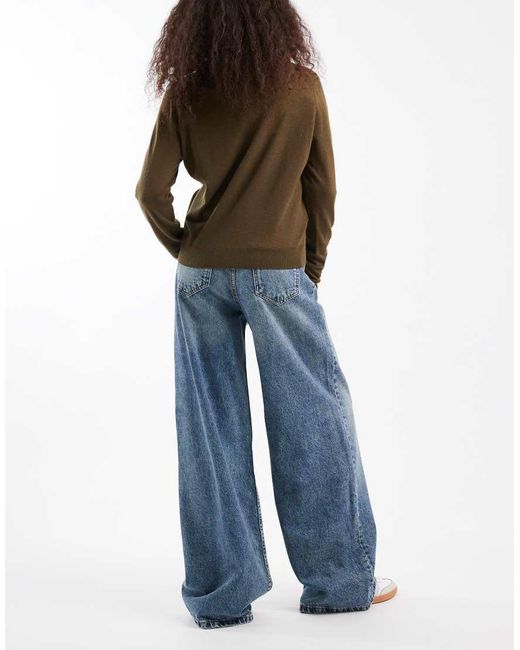 Vaqueros De Pernera Ancha Y Talle Alto Con Lavado Y Detalle De Tira Ajustable De -Azul ASOS de color Blue