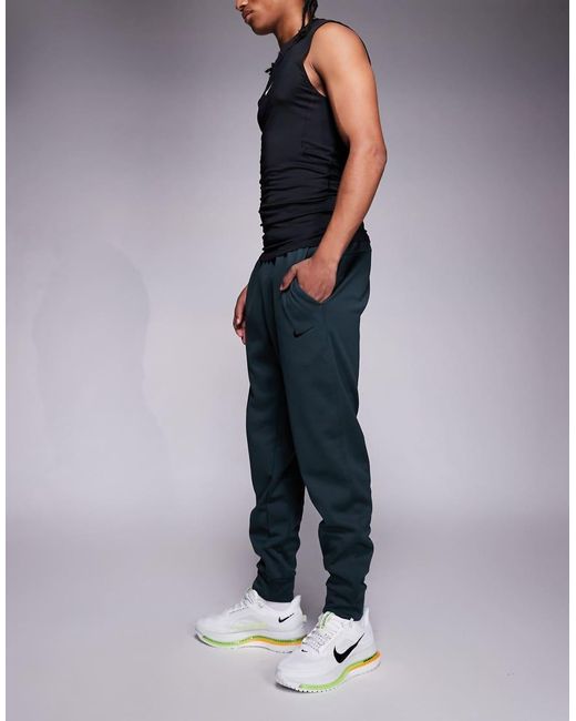 Nike Blue Therma Tapered Trousers for men