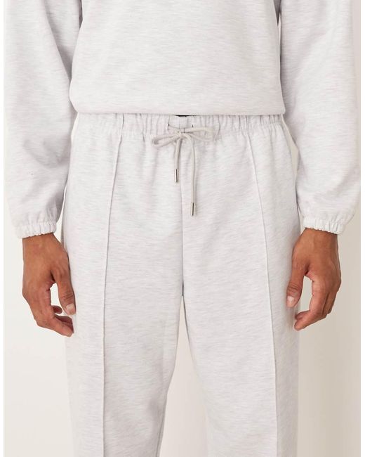 ASOS Ruimvallende Toelopende Joggingbroek Van Stof in het Natural voor heren